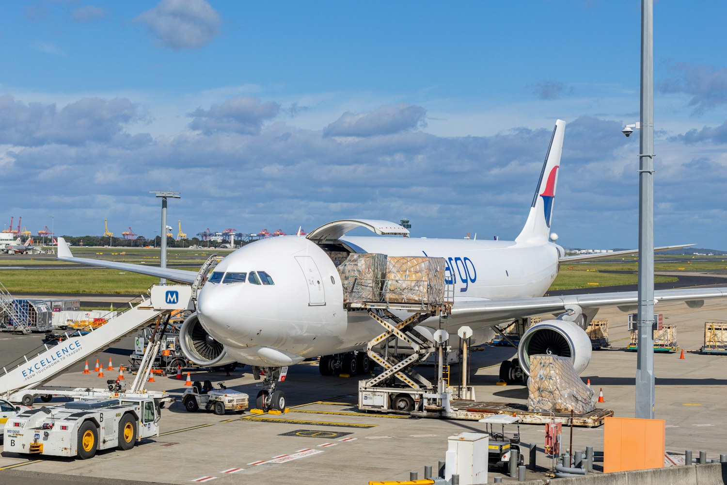 Illustrative freight aircraft being loaded
